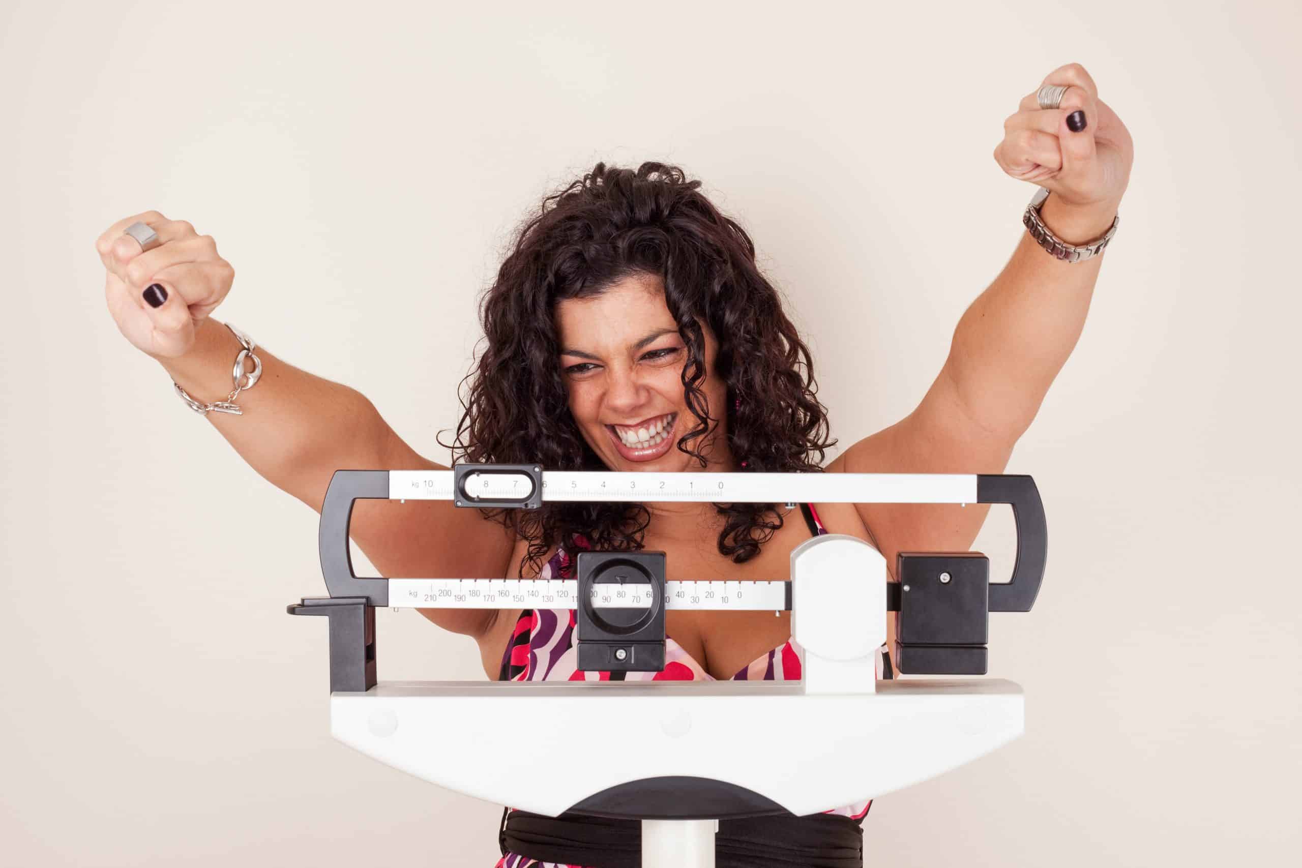 Patient celebrating weight-loss progress with Lose the Weight PA